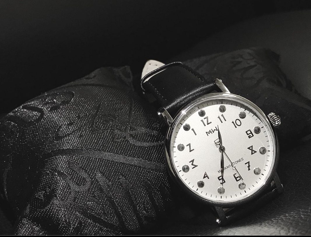 The Tawaf watch on embroidered black cloth, monochrome